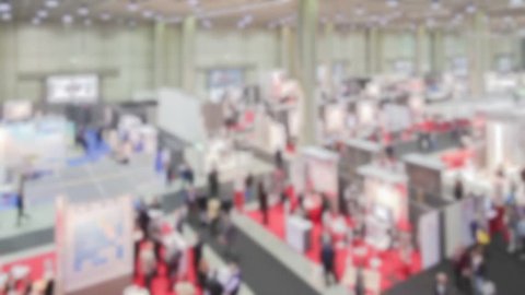 Trade show, panoramic view. Background with an intentional blur effect applied.