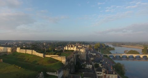 Aerial drone flight near the Castle of Amboise near the river Loire at France, in a beautiful light just after sunrise