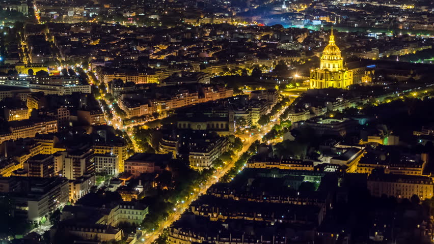 Illuminated Les Invalides building at night, Paris, France. Panoramic view. Street lights and car traffic. Time lapse video.