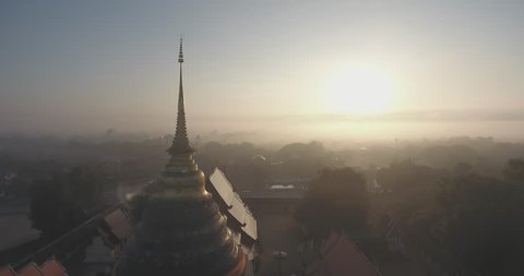 Cinematic Morning Aerial view of Wat Prathat Lampang Luang , Thailand Lampang Temple