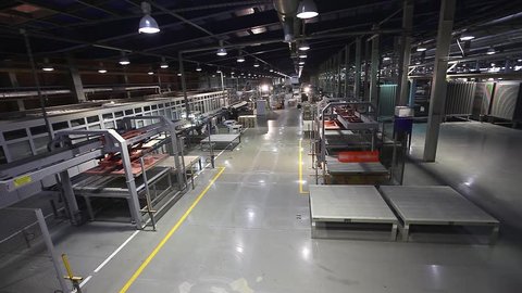 Industrial interior of a modern factory, Manufacturing Plant, AGV transports products, Electrical Automated Guided Vehicles Platform, Automatic stacker, AGV, 