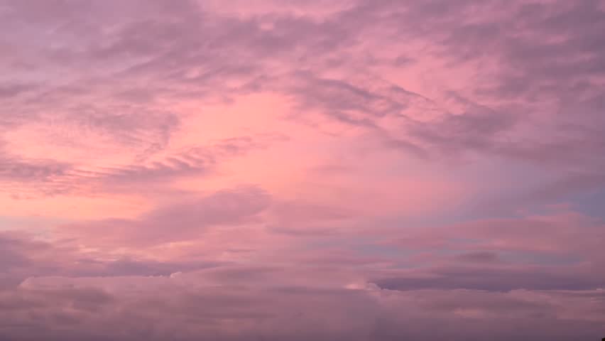 Gently purple sky with pink cloudsduring sunset or sunrise in a tropical climate. A typical Thai twilight. A meditative calming ladscape. Paradise heaven. Exotic colors of the outgoing sun.