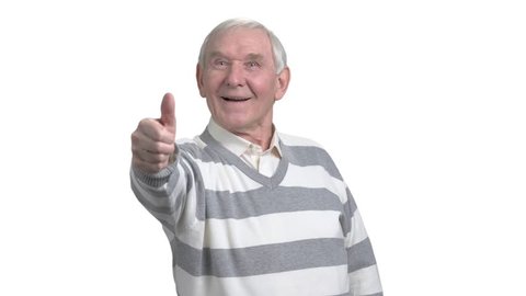 Old man with two thumbs up. Happy senior man giving two thumbs up, isolated on white background. Human facial expressions and body langauge.