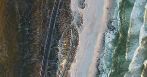 rotating video of a Cape Town coastline at sunset in South Africa, by drone in 4K.