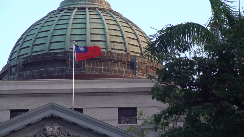 4K Taiwanese flag waving in the wind at the Dome of National Taiwan Museum. Municipal park 228 Peace Memorial Park in Taipei-Dan