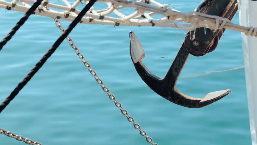 Anchor close-up on a wooden boat docked at the port of Cartagena.Spain.
