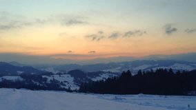 Amazing winter sunrise in the mountains. Fast flying clouds. Dramatic sky. Halo, optical phenomenon. Time lapse video HD
