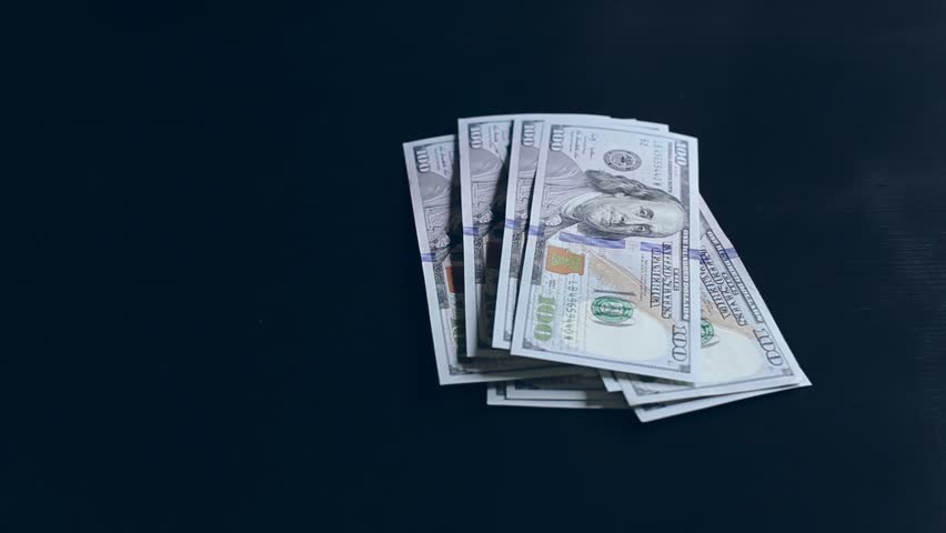 Dollar bill on a black background . finance | Shutterstock HD Video #1007901208