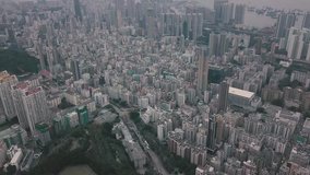 Flying over Hong Kong Kowloon City in a foggy day