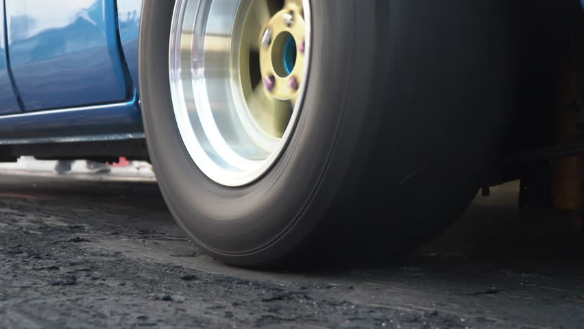 Drag racing car burn tire at start line