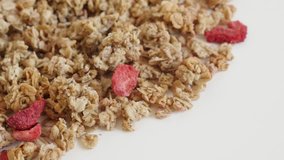 Pile of crunchy cereals 4K 2160p 30fps UltraHD tilting footage - Slow tilt on  muesli with strawberry flavour close-up 3840X2160 UHD video