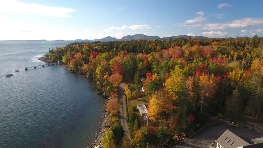 A breathtaking aerial view of Hancock, Maine looking across Mt Desert Narrows to Acadia National Park with the Fall colors in their peak. USA
