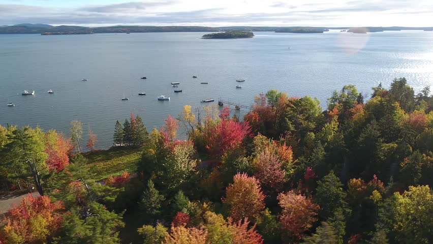 A breathtaking aerial view of Hancock, Maine looking across Mt Desert Narrows to Acadia National Park with the Fall colors in their peak. USA