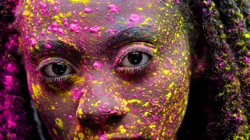 African woman with coloufrul powder on her face and body Royalty-Free Stock Footage #1007944921