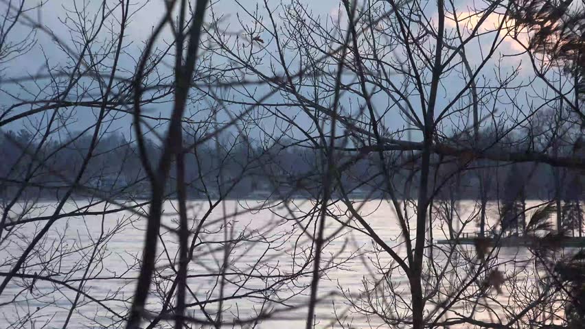 4k Beautiful winter landscape at sunset on frozen lake, Paw Paw Michigan