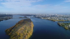 Aerial view. Flight over the city of Kiev in autumn, Ukraine. Video from copter. Flight over the Dnieper river near the South Bridge. View to the left and right bank . 4K, UHD, Ultra HD resolution
