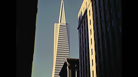 1980s old Transamerica pyramid building in San Francisco skyline with skyscrapers from ground street view. Archival footage in 1980s, California, United States in year 1980.