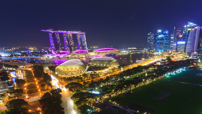 Beautiful Aerial Night Cityscape Of Singapore 4K Time Lapse (pan shot)