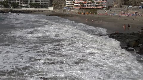 Arguineguin Gran Canaria Spain 15 JAN 2018: Tourists swimming in the sea on Patacalva beach