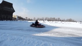 Winter carting. Racing karting in slow motion