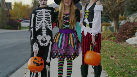Portrait of neighborhood children wearing Halloween costumes / Cedar Hills, Utah, United States