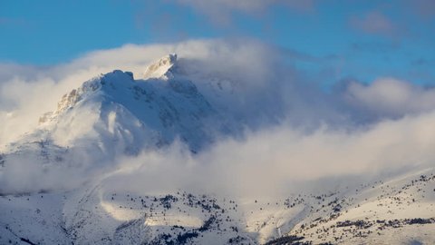 Winter timelapse between sunset and twilight of Bure Peak (Pic de Bure) in the Devoluy Massif. Hautes-Alpes, French Alps, France