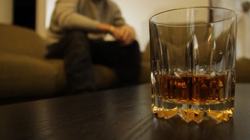 Man Struggles With Alcohol Abuse Glass liquor Whiskey in focus caucasian Royalty-Free Stock Footage #1007998864
