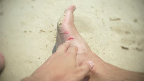 human feet, cut about corals, while swimming in the sea. 4, slow motion