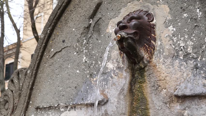 water jet of an ancient and decorated fountain
