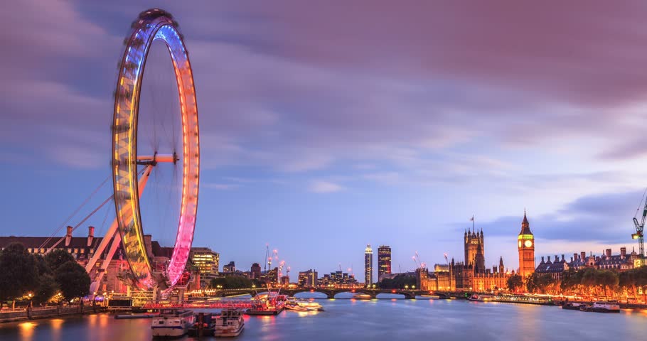 Time lapse of London at twilight from day to night. London eye, County Hall, Westminster Bridge, Big Ben and Houses of Parliament.