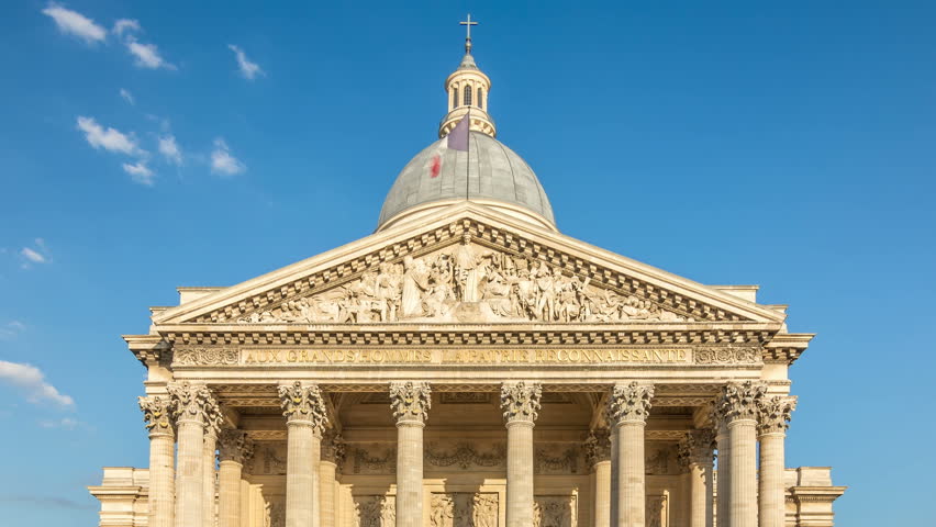 The Pantheon, a neoclassical building in the Latin Quarter in Paris, France. French flag waving in the wind.