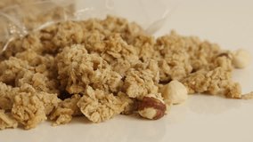 Organic breakfast with crunchy cereals 4K 2160p 30fps UltraHD tilting footage - Sweet healthy muesli with hazelnuts slow tilt 3840X2160 UHD video