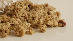 Tilting on organic breakfast with crunchy cereals 4K 2160p 30fps UltraHD footage - Sweet healthy muesli with  hazelnuts slow tilt 3840X2160 UHD video
