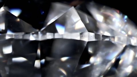 Diamond with GIA number . Diamond with real dispersion on a black background, extreme close up.