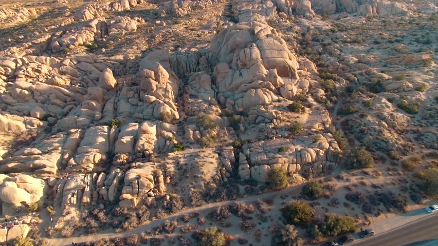 Aerial panorama across rock formations in Joshua Tree National Park at sunset