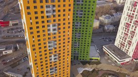 Top view of colored residential complex. Clip. Beautiful stylish houses of different colors in a luxury residential complex