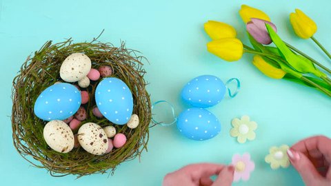 Happy Easter overhead with Easter eggs and decorations on a wood table background time lapse,