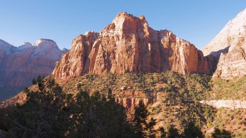 Shot camera movement, view from the car. Moving on a high mountain pass offering amazing nature views of the red rocks of the canyon. At Zion National Park, Utah, USA. Slow motion, 3840x2160, 4K.