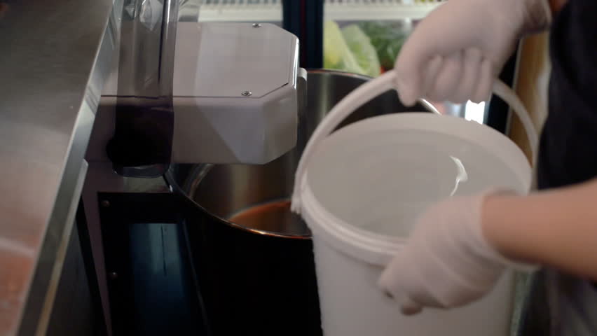 Worker is filling mixer with water | Shutterstock HD Video #1008062587