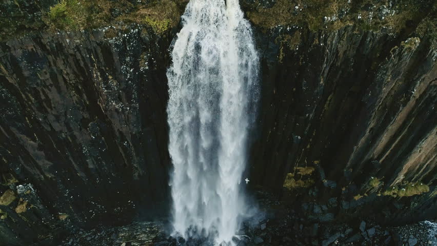 Aerial footage in slow motion of Kilt Rock and Mealt Falls from the Isle of Skye in Scotland, UK with seagull flying Royalty-Free Stock Footage #1008063907