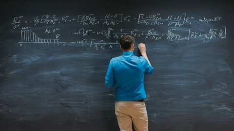 Time-Lapse of the Brilliant Young Mathematician Writes Complex Equation on the Blackboard. Shot on RED EPIC-W 8K Helium Cinema Camera.