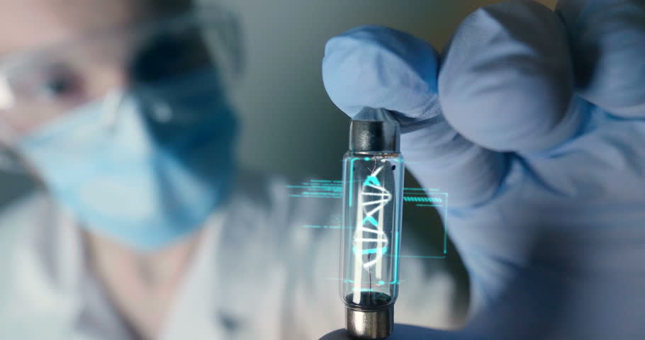 A scientist in his laboratory holds a test tube containing DNA and is able to control the evolution of man thanks to holography. Concept of: DNA, technology, augmented reality.