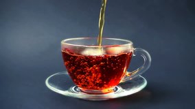 Tea is poured into the cup.	Slow Motion. - Powered by Shutterstock - Get 15% off with code: PIKWIZARD15