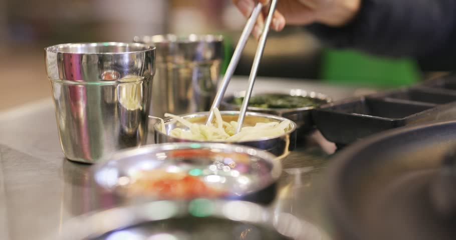 Having korean appetizer in restaurant 