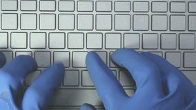 A scientist writes a message using a special 10-character alphabet in blue gloves Special keyboard without symbols. Blind Typing Method. Loopable video