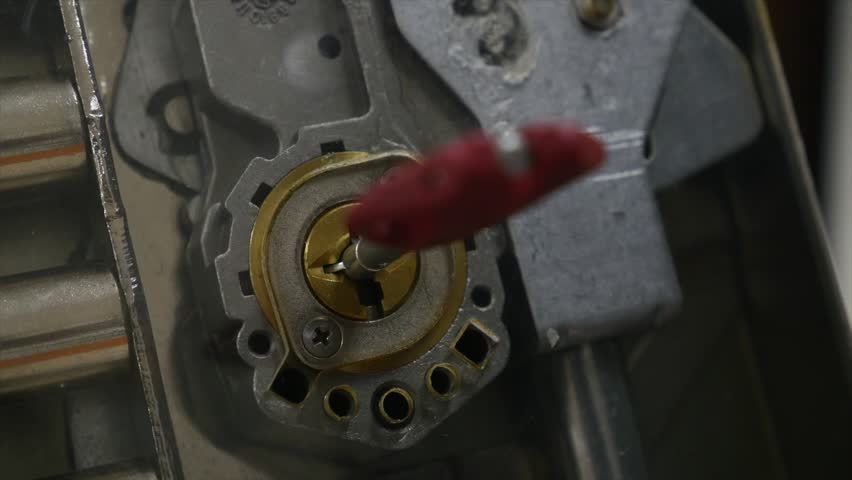Turned key inside the lock close-up | Shutterstock HD Video #1008083596