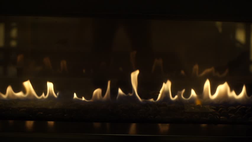 Fire flame Flames in a Modern Fireplace roaring gas burning indoor at night Royalty-Free Stock Footage #1008084409