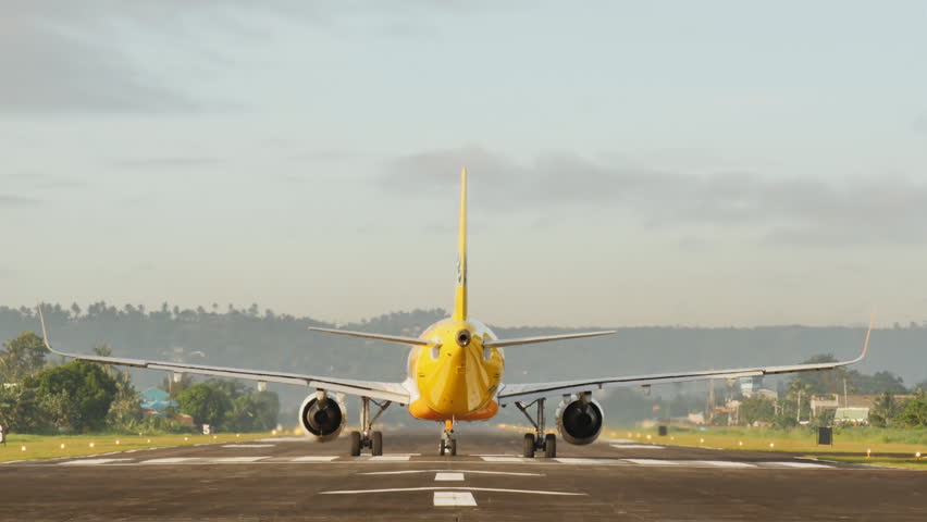 The aircraft is prepared for takeoff on the runway and takes off. Legazpi city. Philippines.
