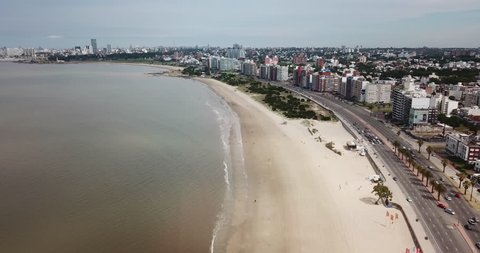 Aerial - Flying over beach and city coast in Montevideo - Uruguay