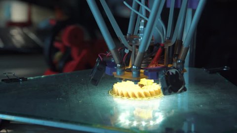 Close-up view of innovative 3d printing machine in process of work. Static 4K shot on Red cinema camera. Static 4K shot on Red cinema camera.